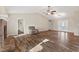 Bright living room with hardwood floors and a stone fireplace, showcasing a cozy and inviting space at 2511 Countryside Westview Dr, Shelbyville, IN 46176