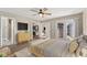 This beautiful main bedroom boasts wood floors, a ceiling fan, and a walk-in closet at 2511 Countryside Westview Dr, Shelbyville, IN 46176