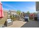 Spacious wooden deck with stylish wicker seating, privacy screen, and outdoor heater under clear blue sky at 2936 W Calimanco Ln, Monrovia, IN 46157