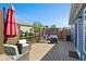 Inviting wooden deck features wicker seating, privacy screen, outdoor heater, and landscaped yard at 2936 W Calimanco Ln, Monrovia, IN 46157