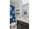 Full bathroom with marble countertops, a dark wood vanity, and blue 'Baby Yoda' shower curtain at 2936 W Calimanco Ln, Monrovia, IN 46157