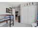 Bedroom with closet includes a bunk bed, decorated with comic books and leads into the kitchen at 2936 W Calimanco Ln, Monrovia, IN 46157