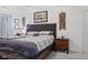 Spacious bedroom boasts a comfortable bed with a gray headboard and wooden nightstand at 2936 W Calimanco Ln, Monrovia, IN 46157