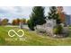 Stone entrance sign with established landscaping, and split rail fencing leading to the community at 2936 W Calimanco Ln, Monrovia, IN 46157