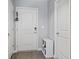 Clean entryway with white door, vinyl floors, shoe storage, and coat hooks at 2936 W Calimanco Ln, Monrovia, IN 46157