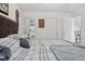 Comfortable main bedroom with a plaid comforter and soft throw blanket plus multiple doors at 2936 W Calimanco Ln, Monrovia, IN 46157