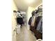 Spacious walk-in closet featuring clothing racks, shelving, and storage; carpeted floor and ample space for organizing at 2936 W Calimanco Ln, Monrovia, IN 46157