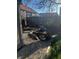 A serene backyard showcasing a charming fountain with stone landscaping and a wood fence at 300 E Monroe St, Franklin, IN 46131