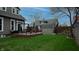 Charming backyard featuring a deck, a cozy swing and green lawn area at 300 E Monroe St, Franklin, IN 46131
