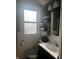 A cozy bathroom featuring a vanity and a window that allows natural light to flood the room at 300 E Monroe St, Franklin, IN 46131