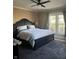 A spacious bedroom featuring a large bed, a cozy rug, and a window allowing ample natural light at 300 E Monroe St, Franklin, IN 46131
