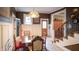 Inviting dining room with charming light fixture and stairwell access at 300 E Monroe St, Franklin, IN 46131