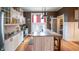 Bright kitchen features custom cabinets, an island and walk-in pantry at 300 E Monroe St, Franklin, IN 46131