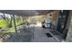 Inviting covered back porch with seating area, perfect for outdoor relaxation and entertaining at 3311 Stella St, Greenwood, IN 46143
