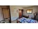 Comfortable bedroom with a patterned quilt, accent chair, and closet, offering a relaxing retreat at 3311 Stella St, Greenwood, IN 46143