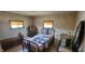 Bedroom featuring a patterned quilt, fair lighting from the windows, and wooden flooring at 3311 Stella St, Greenwood, IN 46143