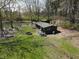 Lakeside retreat with cabin, fire pit, and ample outdoor space for relaxation at 3311 Stella St, Greenwood, IN 46143
