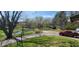 Scenic view of a red truck parked near a home, overlooking a tranquil pond and tree-lined landscape at 3311 Stella St, Greenwood, IN 46143