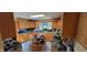 Bright kitchen featuring ample cabinet space, a skylight, and a cozy dining area at 3311 Stella St, Greenwood, IN 46143
