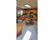 Well-lit kitchen with a skylight, light wood cabinets, and a dining area with table and chairs at 3311 Stella St, Greenwood, IN 46143