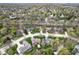 Birds eye view of suburban neighborhood with mature trees and greenery showcasing community and location at 334 Stonehedge Dr, Carmel, IN 46032