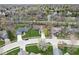 Aerial view of a beautiful home with green lawns, mature trees, and a well-maintained neighborhood at 334 Stonehedge Dr, Carmel, IN 46032