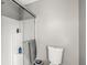 Bathroom featuring white walls, toilet, shower with glass doors and steel fixtures at 334 Stonehedge Dr, Carmel, IN 46032