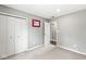 Neutral bedroom featuring gray walls, gray carpet, and closet with double doors at 334 Stonehedge Dr, Carmel, IN 46032
