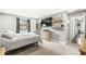 Bedroom featuring gray walls, gray carpet, a window, shelving and a large television at 334 Stonehedge Dr, Carmel, IN 46032