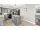Kitchen with a center island, stainless steel appliances, and gray cabinets at 334 Stonehedge Dr, Carmel, IN 46032