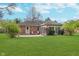 Spacious backyard featuring a well-maintained lawn and a patio with outdoor seating at 3462 Briar Creek Ln, Carmel, IN 46033
