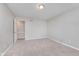 Empty bedroom with carpet flooring, neutral walls, and two doors at 3462 Briar Creek Ln, Carmel, IN 46033