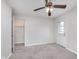 Bedroom featuring a ceiling fan, a closet and an exit door leading outside at 3462 Briar Creek Ln, Carmel, IN 46033