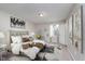 Stylized bedroom with decorative hanging chair, large headboard, and modern decor at 3462 Briar Creek Ln, Carmel, IN 46033