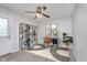 Bedroom featuring a ceiling fan, a work desk with decorative shelving and stylish modern decor at 3462 Briar Creek Ln, Carmel, IN 46033