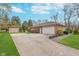 Spacious two-car garage with extra parking and a storage shed at 3462 Briar Creek Ln, Carmel, IN 46033