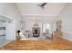Bright living room with vaulted ceilings, fireplace, and hardwood floors at 3462 Briar Creek Ln, Carmel, IN 46033