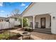 Inviting backyard features a cozy fire pit and a charming porch with rocking chairs and welcome decor at 350 W Pearl St, Greenwood, IN 46142