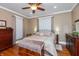 Well-lit bedroom with hardwood floors, classic decor, and ample closet space at 350 W Pearl St, Greenwood, IN 46142