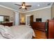 Inviting bedroom featuring hardwood floors, warm lighting, and comfortable furnishings at 350 W Pearl St, Greenwood, IN 46142