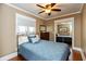 Comfortable bedroom with ceiling fan, hardwood floors, and a closet with mirrored doors at 350 W Pearl St, Greenwood, IN 46142