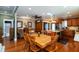 Inviting dining area adjacent to a spacious kitchen, featuring hardwood floors and stylish decor at 350 W Pearl St, Greenwood, IN 46142