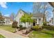 Charming home featuring meticulous landscaping and a cozy front porch at 350 W Pearl St, Greenwood, IN 46142