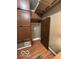 Hallway with storage above closet, flooring, and a door to another room at 350 W Pearl St, Greenwood, IN 46142