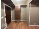 Hallway with storage, flooring, and a door to another room at 350 W Pearl St, Greenwood, IN 46142