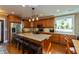 Modern kitchen with stainless steel appliances, granite countertops, and wooden cabinets at 350 W Pearl St, Greenwood, IN 46142