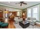Warm living room with natural light, hardwood floors, and a view to the kitchen at 350 W Pearl St, Greenwood, IN 46142