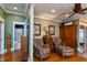 Comfortable living space with hardwood floors, decorative accents, and a view to the bathroom at 350 W Pearl St, Greenwood, IN 46142
