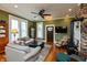 Cozy living room with hardwood floors, wood-burning stove, and lots of natural light at 350 W Pearl St, Greenwood, IN 46142