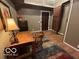 Bright office space with desk, cozy rug, and ample storage options at 350 W Pearl St, Greenwood, IN 46142